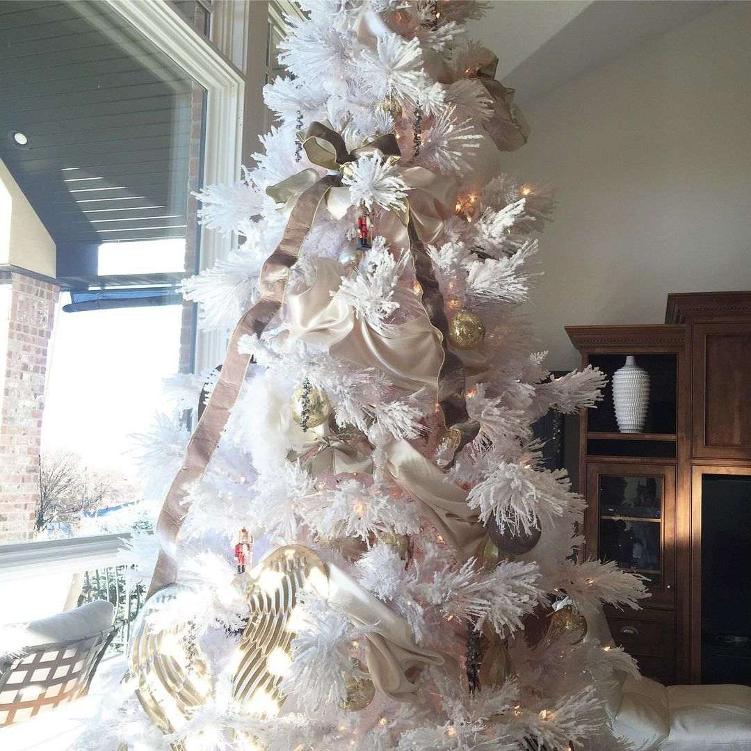 White decorated Christmas Tree with pink accents