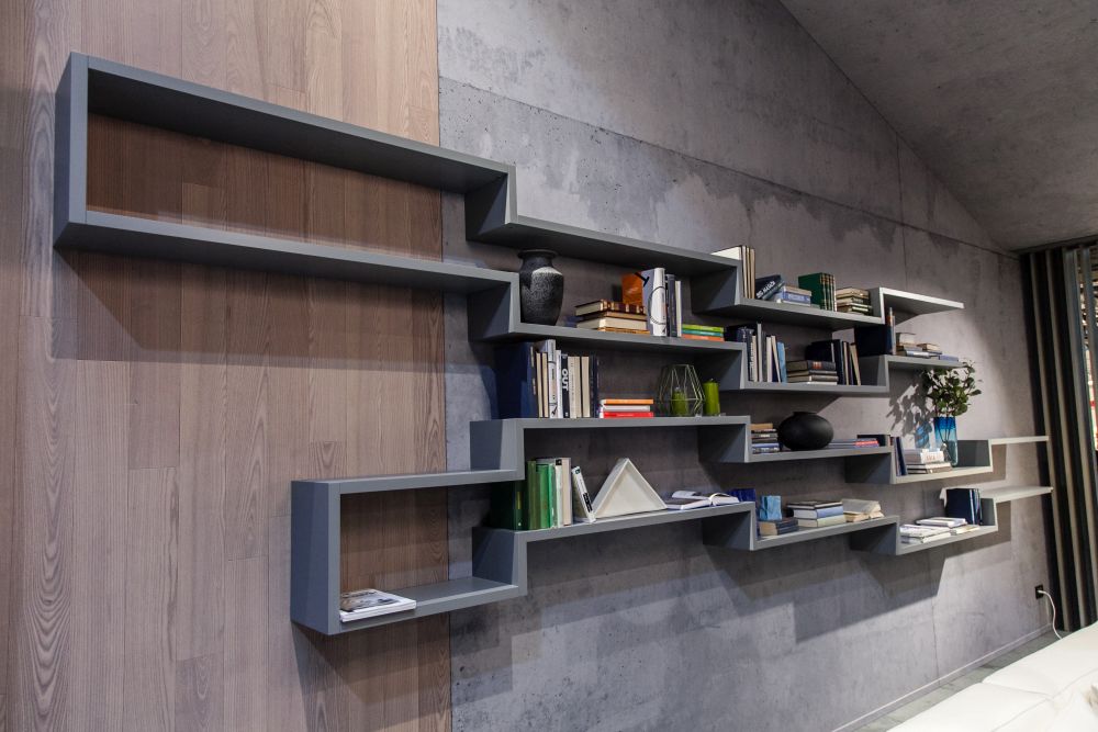 Fill the empty walls with shelves and decorate with books