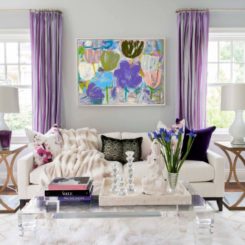 Living room with modern furniture and purple curtains
