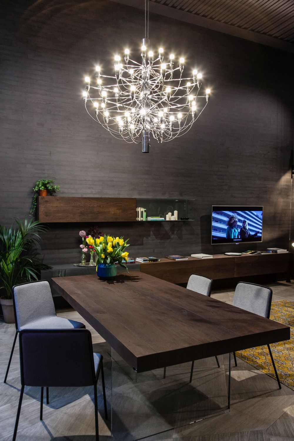 Make a large and sophisticated chandelier the focal point of the entire floor plan, not just the dining area