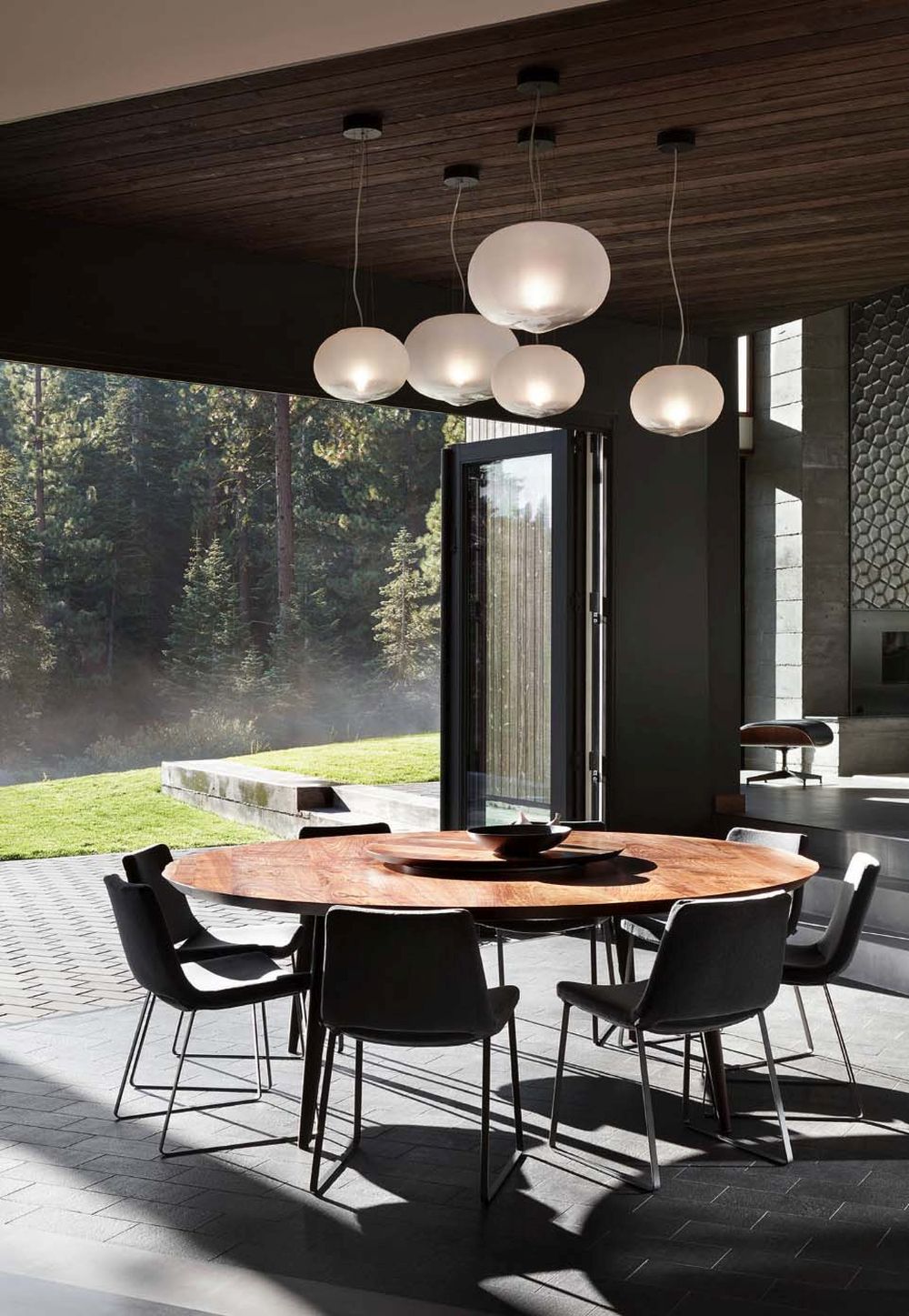 The dining area can be directly connected to the backyard by opening up the folding glass doors