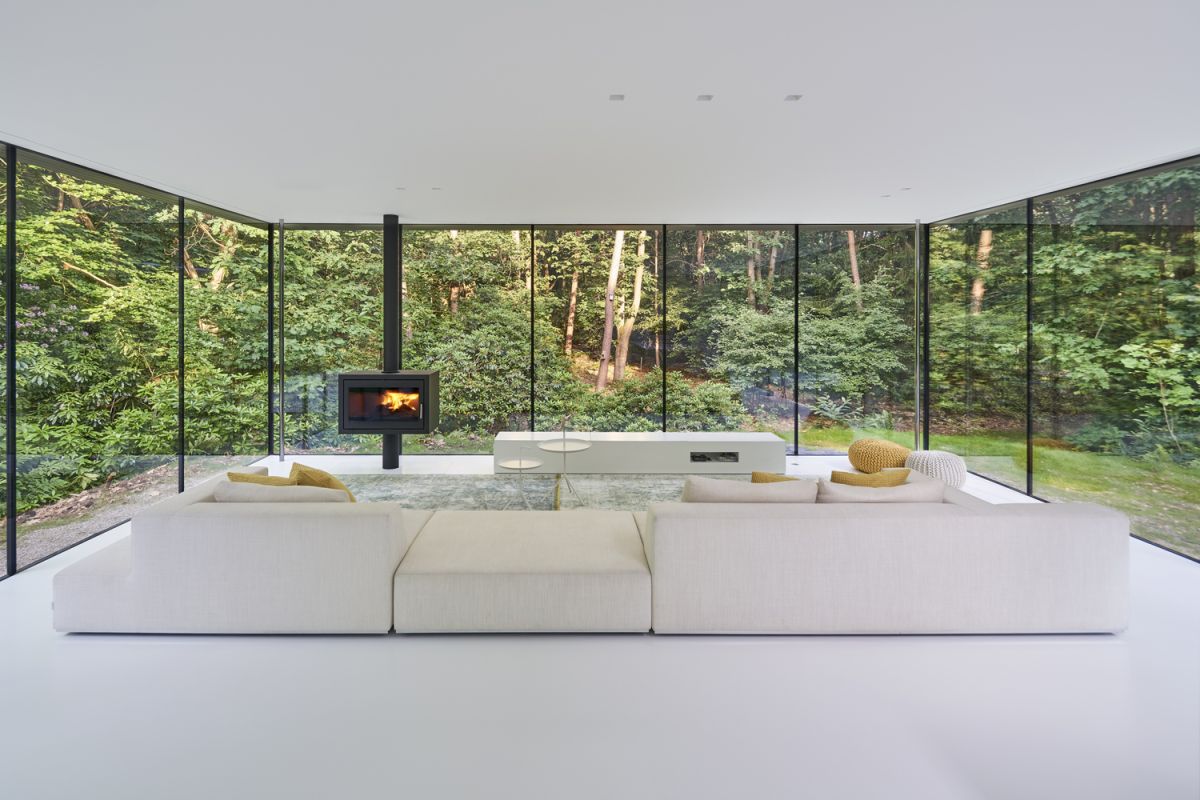 Contemporary living room with polished floor and wood tables