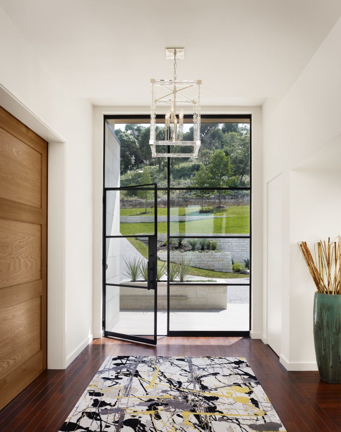 Contemporary glass front door with a steel frame