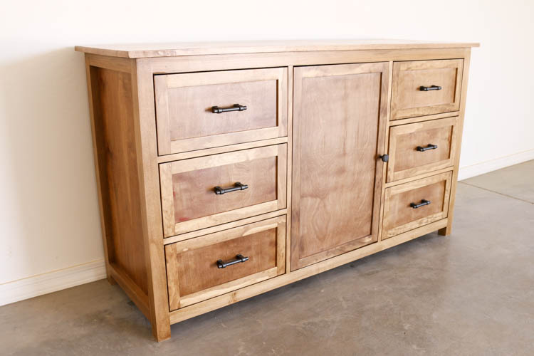 Wooden dresser with shelved in the middle and drawers on the sides