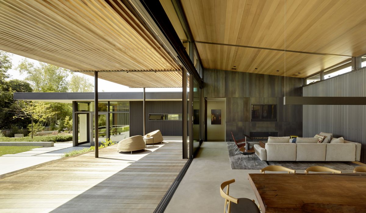 High ceiling living room with steel fireplace