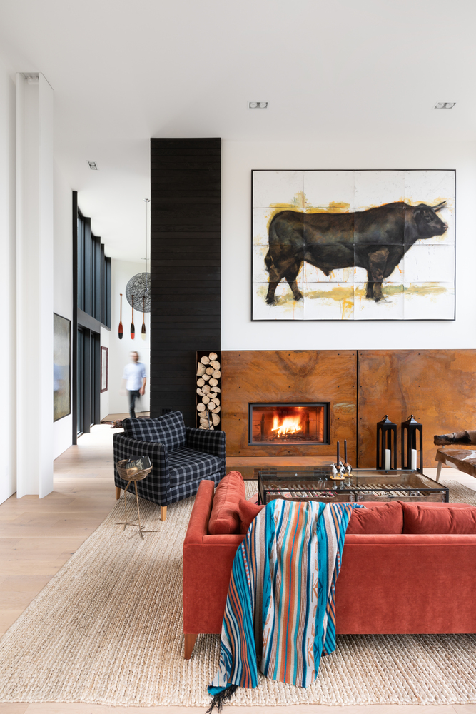 High ceiling living room with steel fireplace