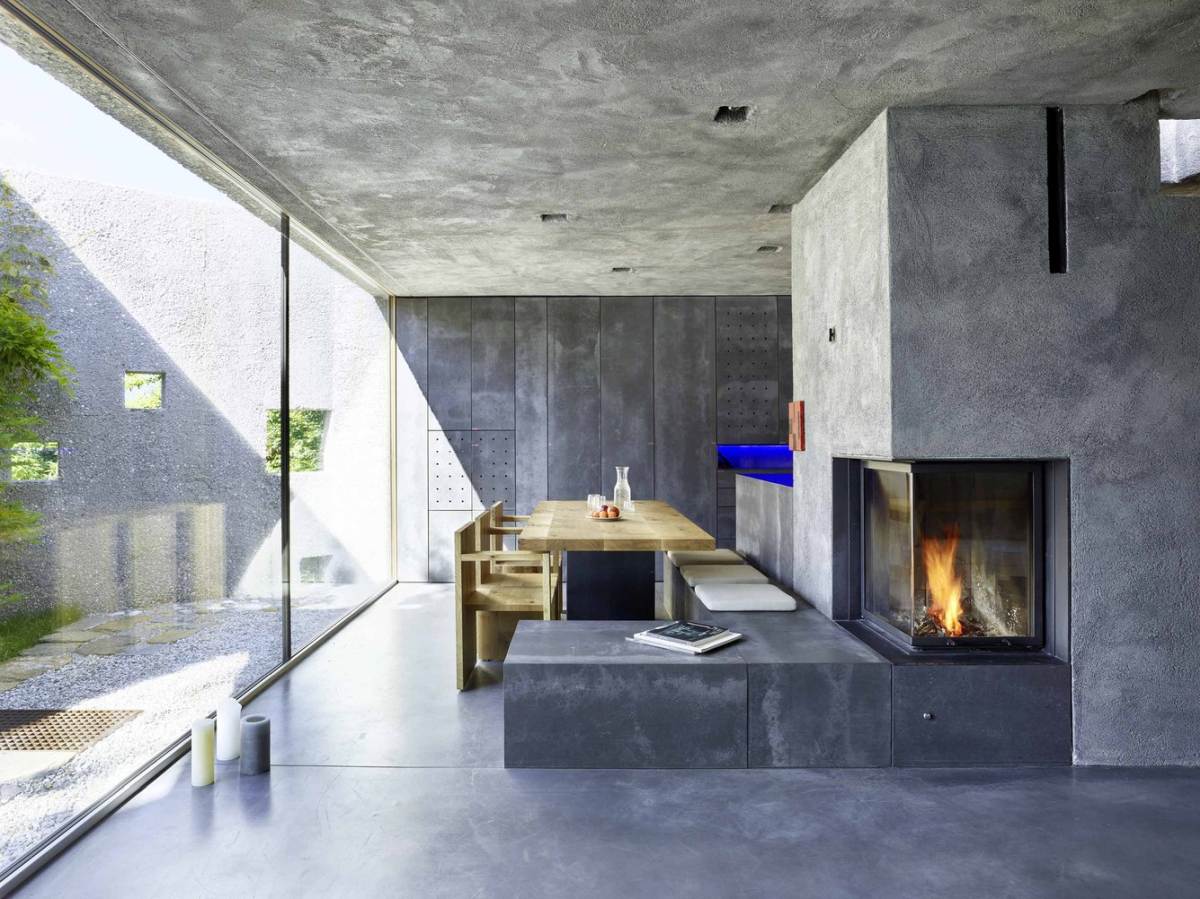 A concrete house with lush surroundings swiss