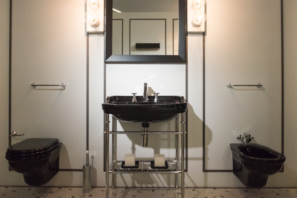 Black bathroom set with toilet bowl bided and sink