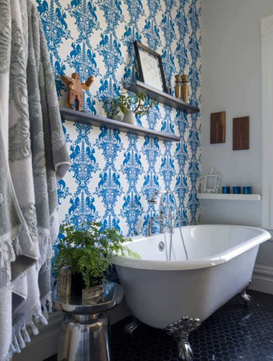 Blue wallpaper bathroom and floating shelves