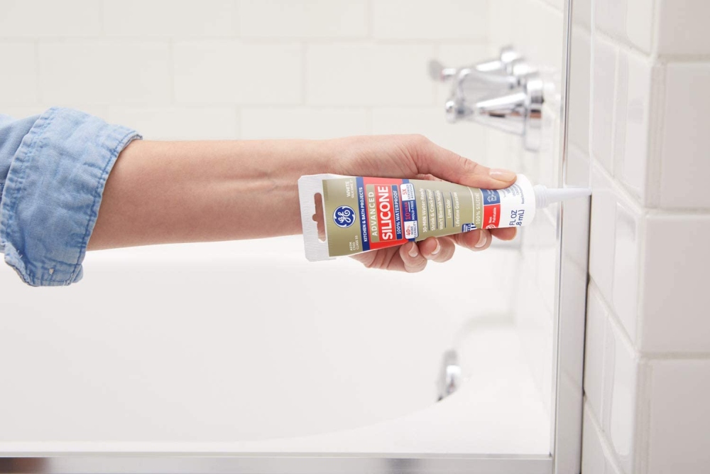 Caulk around the shower fixture