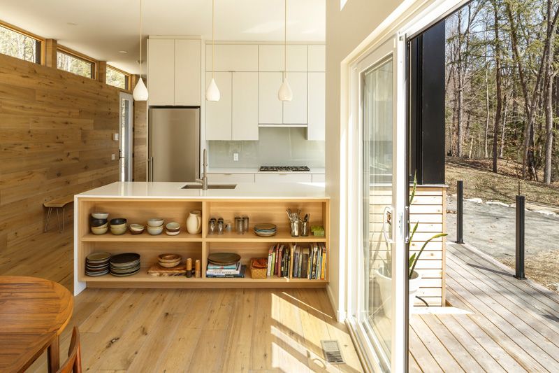 Lakeside cottage with a fresh design perspective fireplace