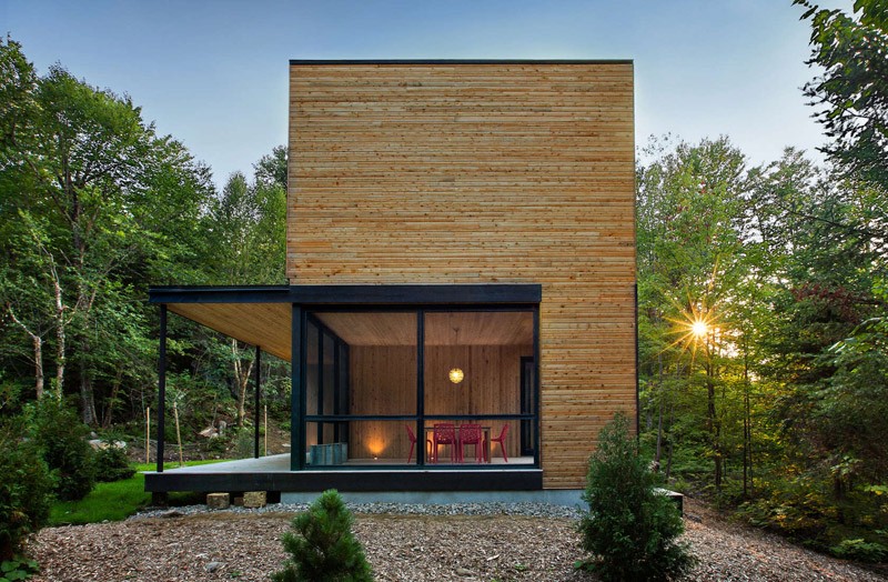 Lakeside retreat surrounded by forest side view