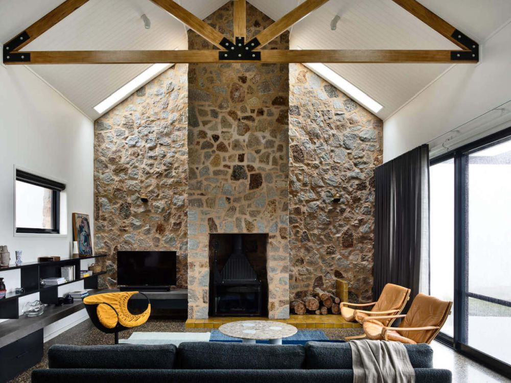 Living Room with red and white floor and fireplace by Elizabeth Roberts Architects 