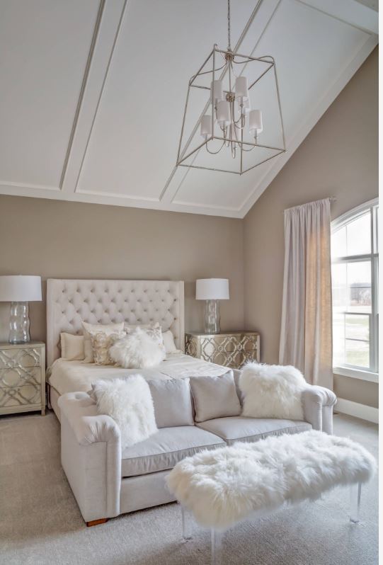 Couch and fur stool in bedroom white