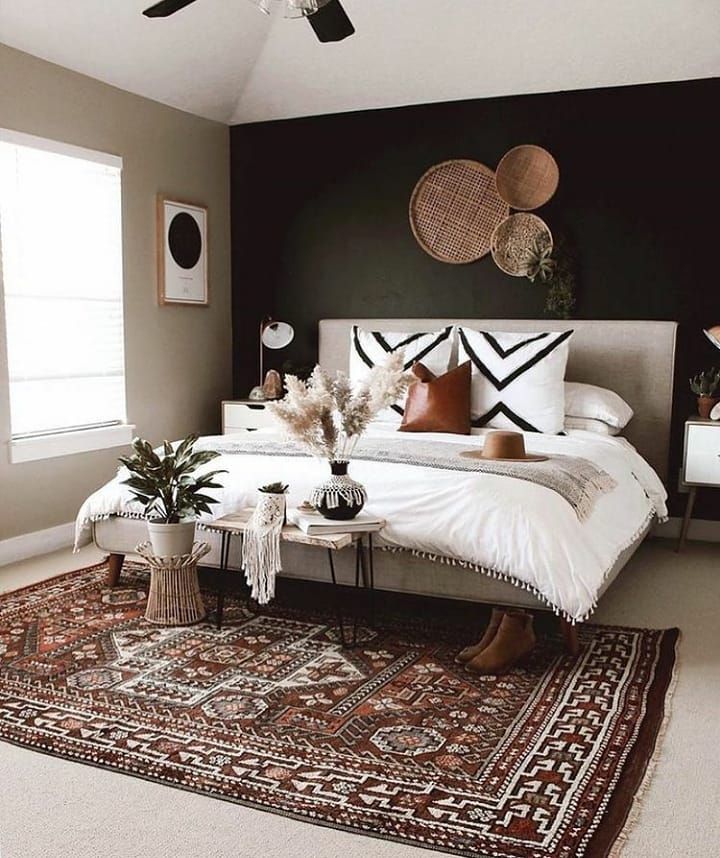 Bedroom with black wall and white bed cover