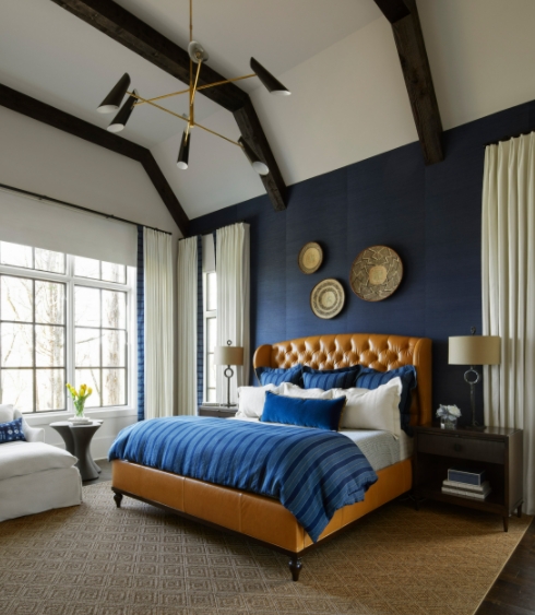 Brown bed leather and blue walls