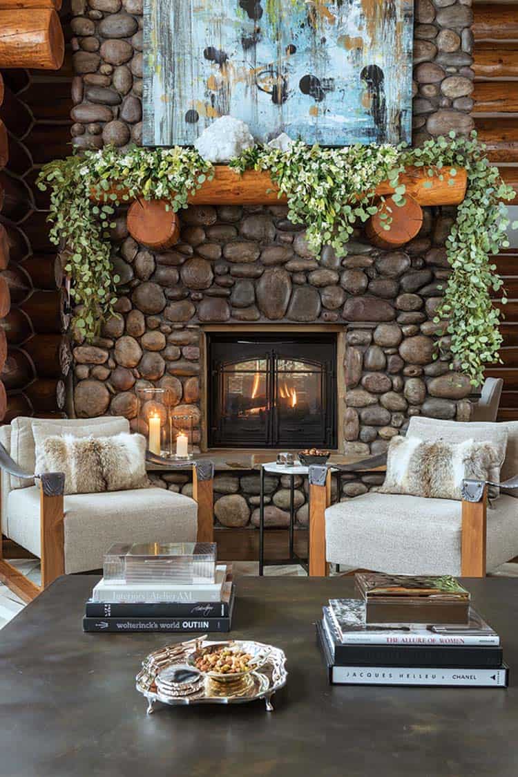 Rustic log cabin with a modern interior fireplace river rocks