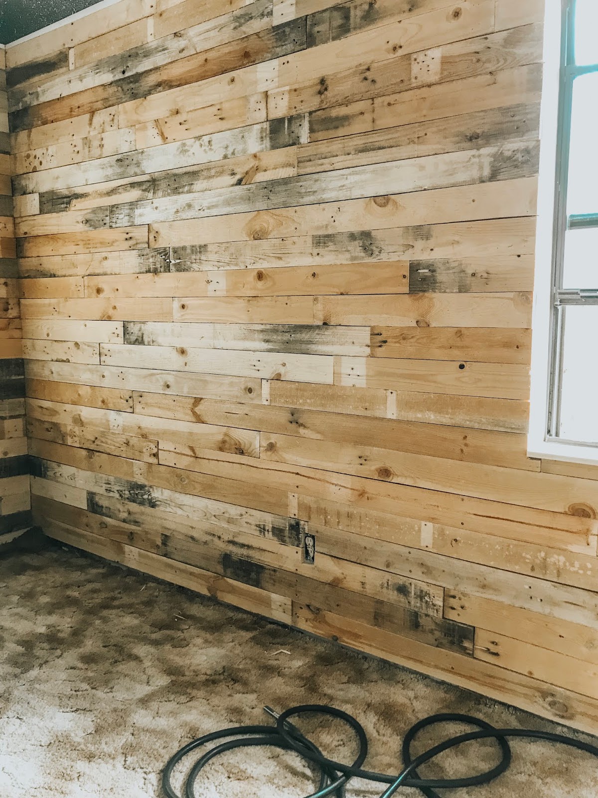 Old Pallets Replaced the Paneling They Removed