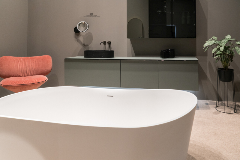 A Lounge Chair Adds a Place to Sit Beside the Bath