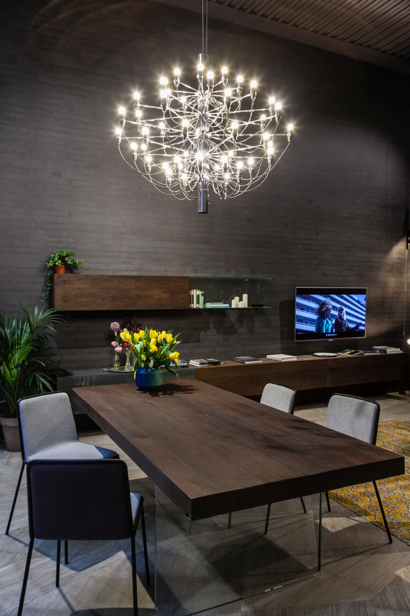 A floating media cabinet stretches beyond the television