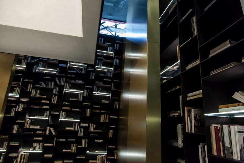 A floor-to-ceiling library turns books into a wall pattern