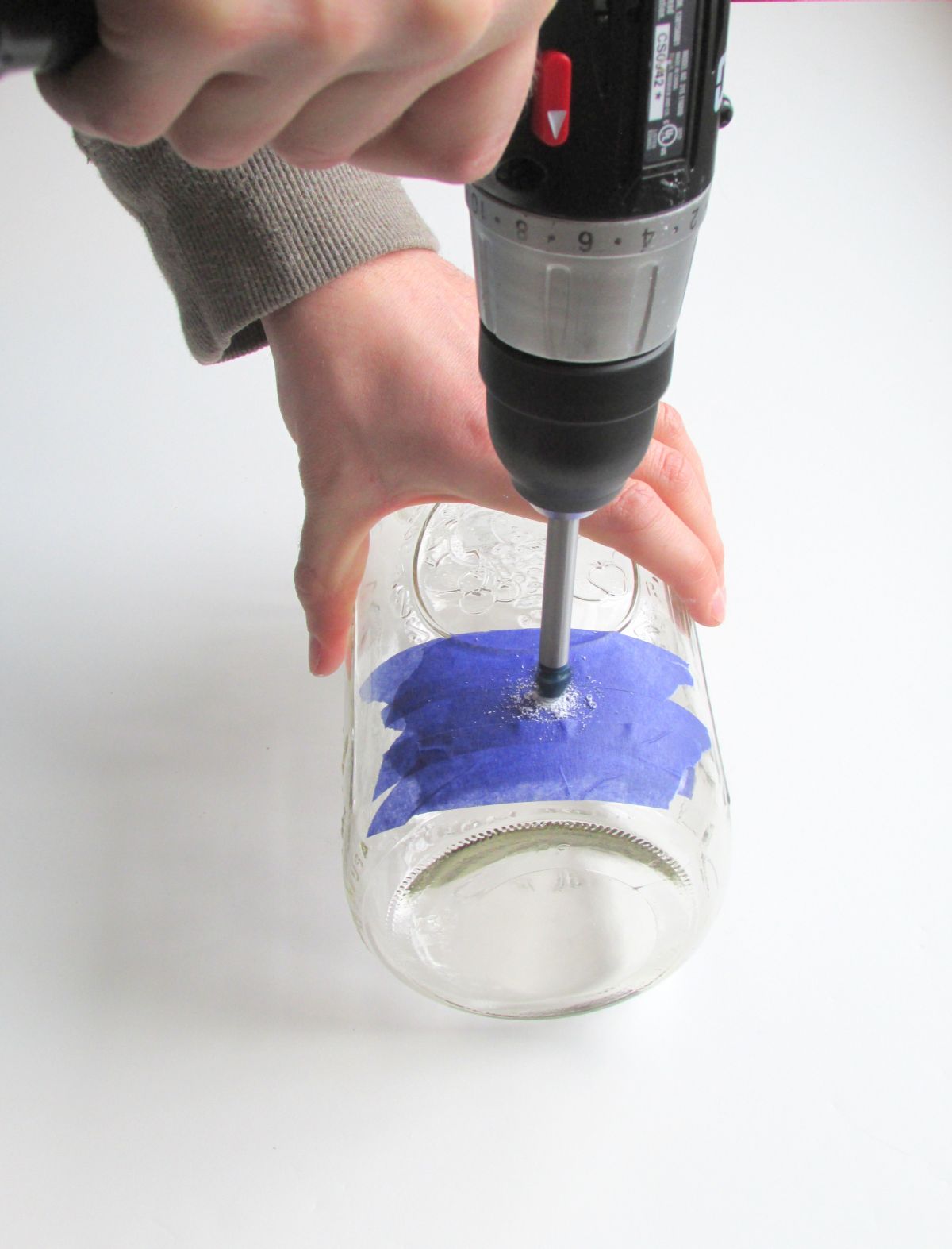A glass drill bit creates the cord openin