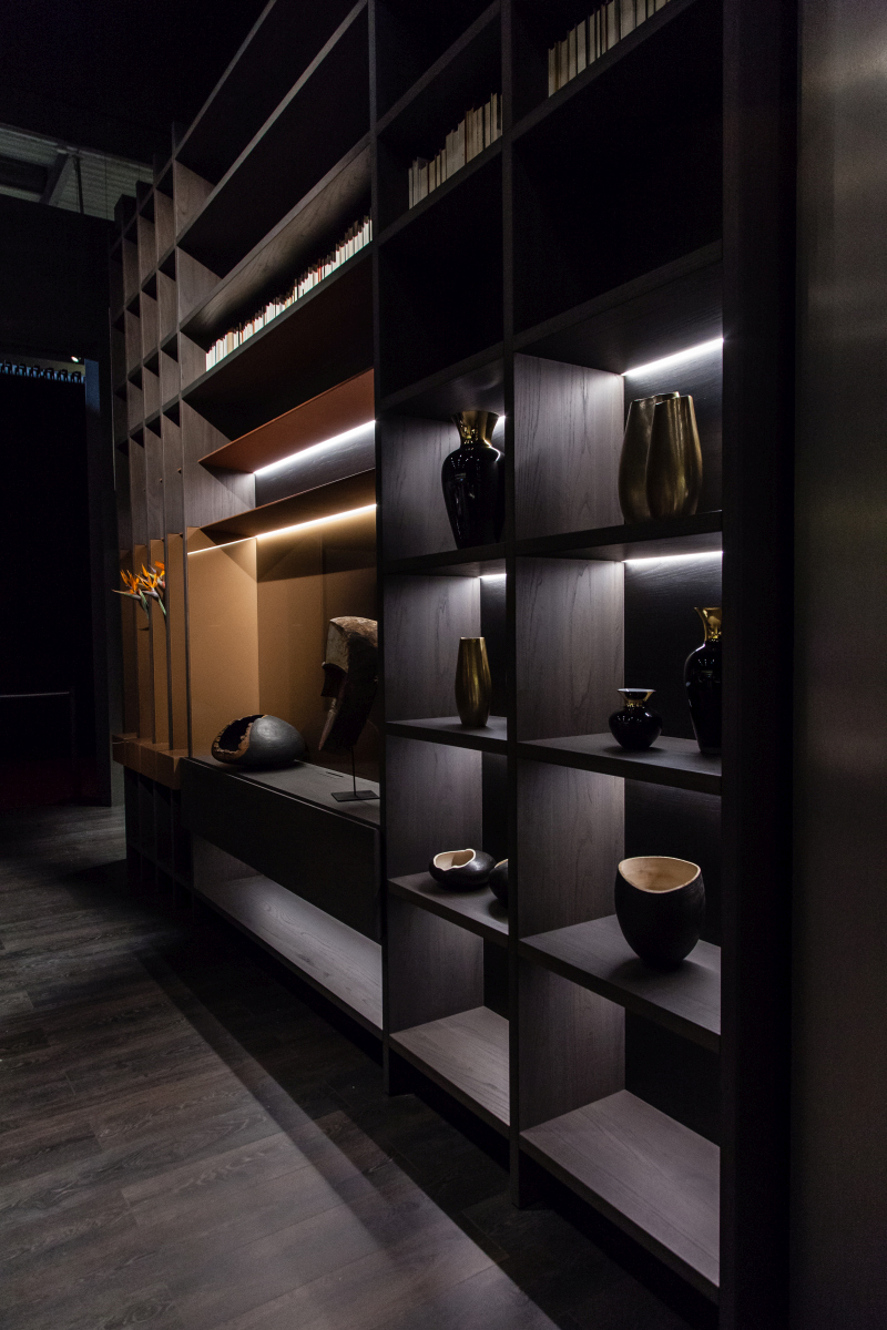 An oversized bookcase breaks away from the standard grid