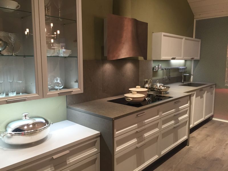 Another kitchen pairs dark metal cabinetry