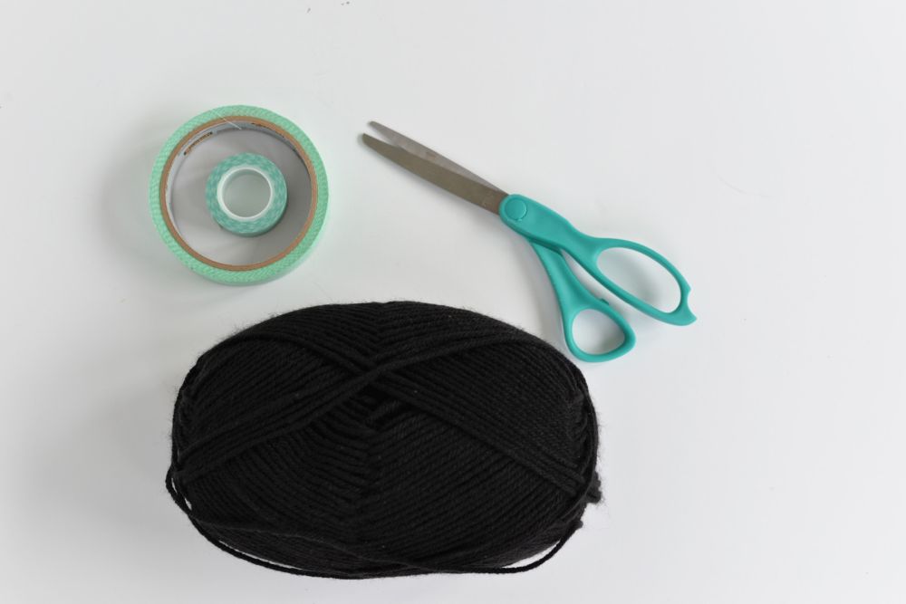 Black Yarn and Tape Replaced Store-Bought Spiderweb Decorations