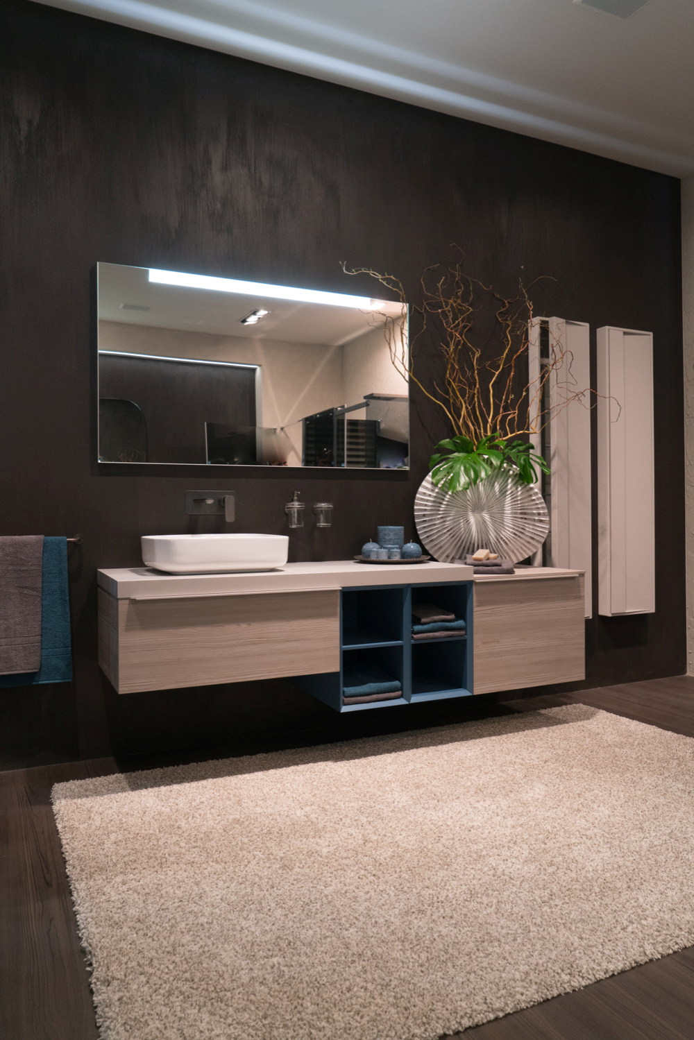 Blue Cubbies Divide a Long Vanity Into Separate Sections