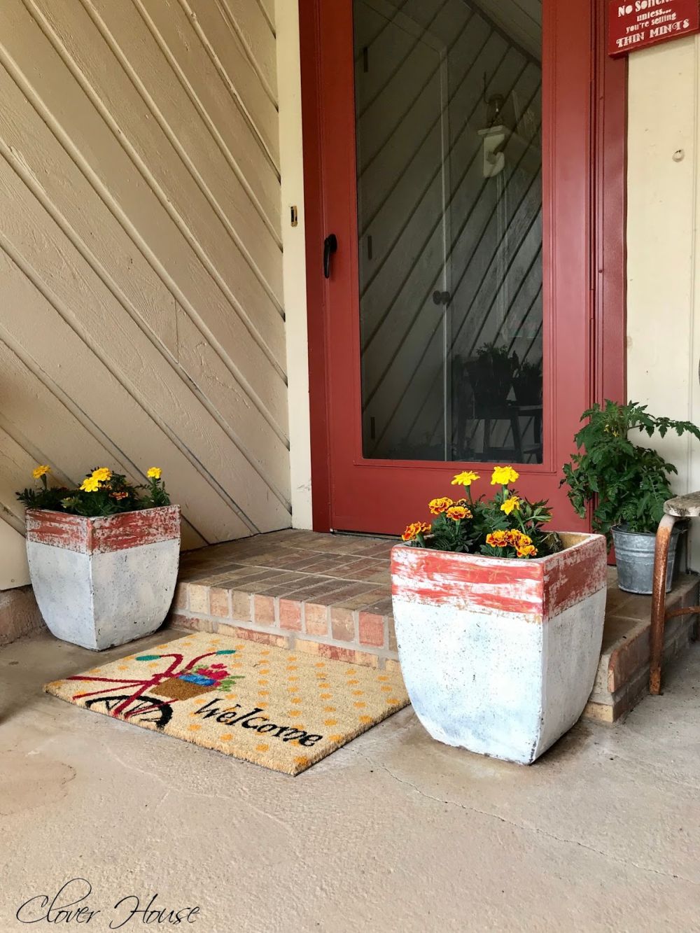 Both planters were placed beside the front entrance,
