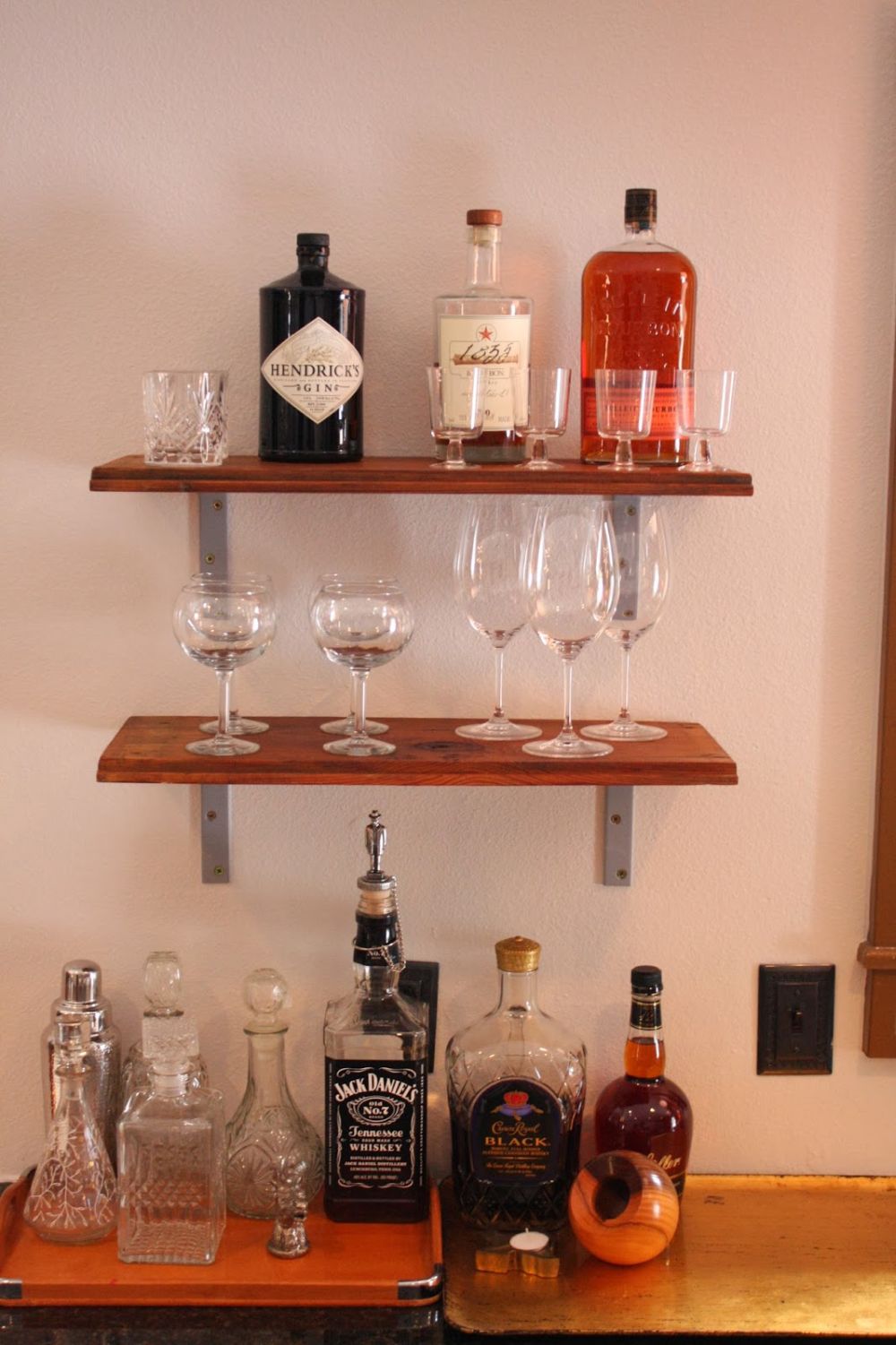 Bottles and glassware completed the kitchen bar
