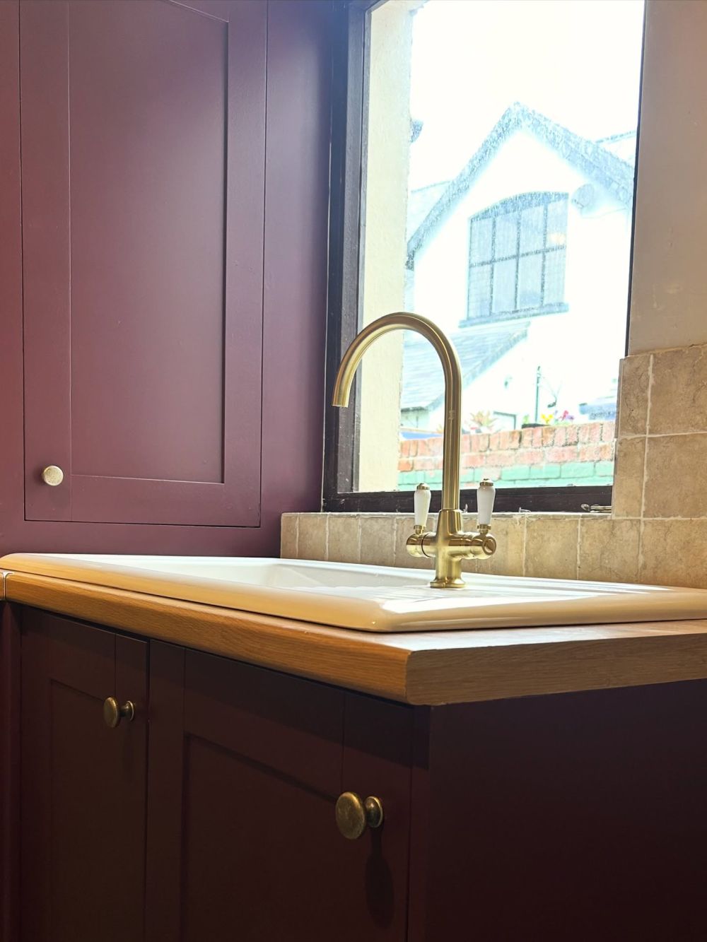 Brass-toned fittings stand out against the dark doors