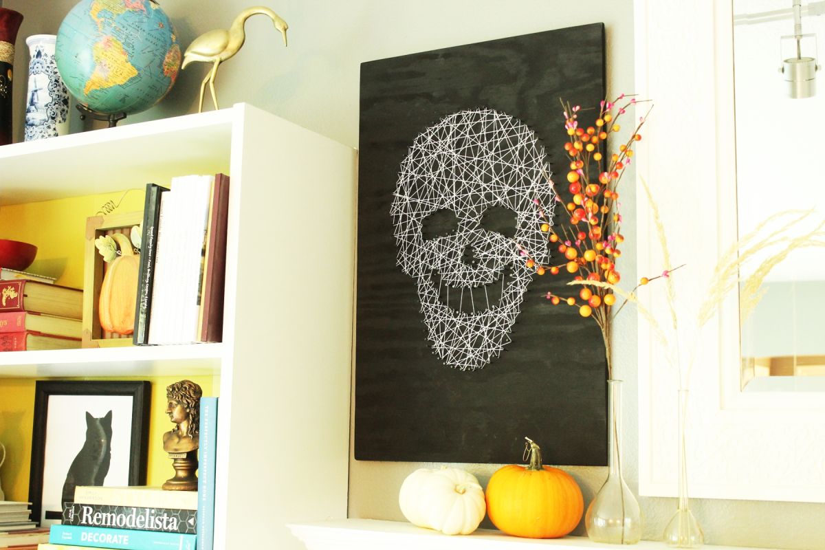 Brittney displayed the artwork beside a white bookcase