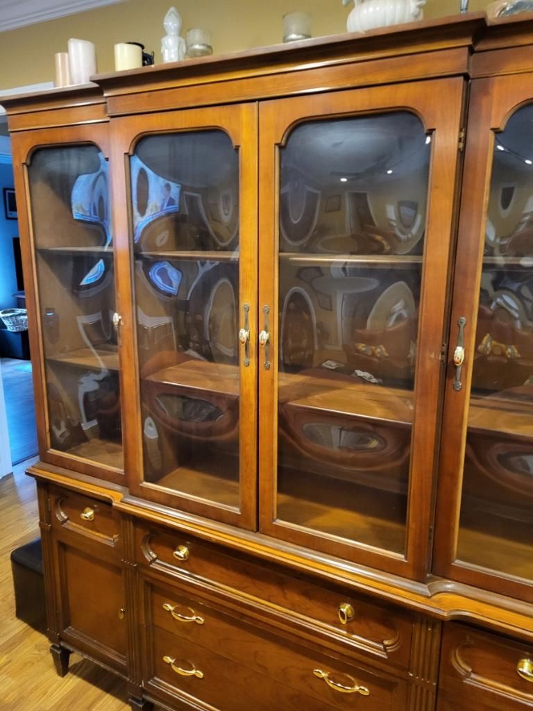 Brown Wood and Curved Glass Defined the Original Cabinet