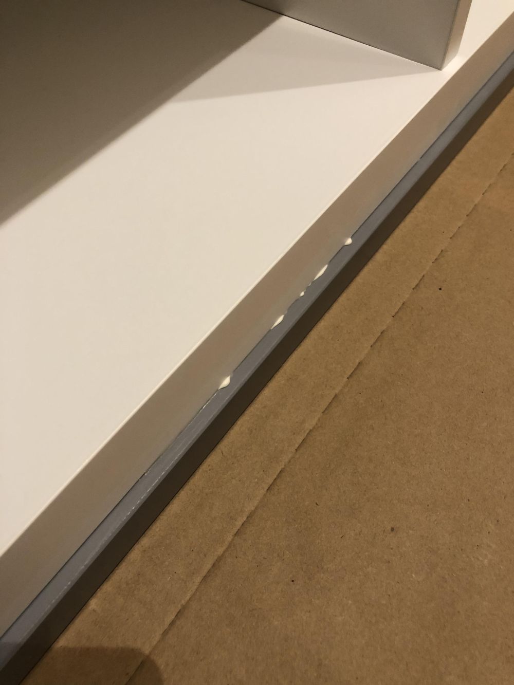 Centering the front-facing shelf left narrow gaps a