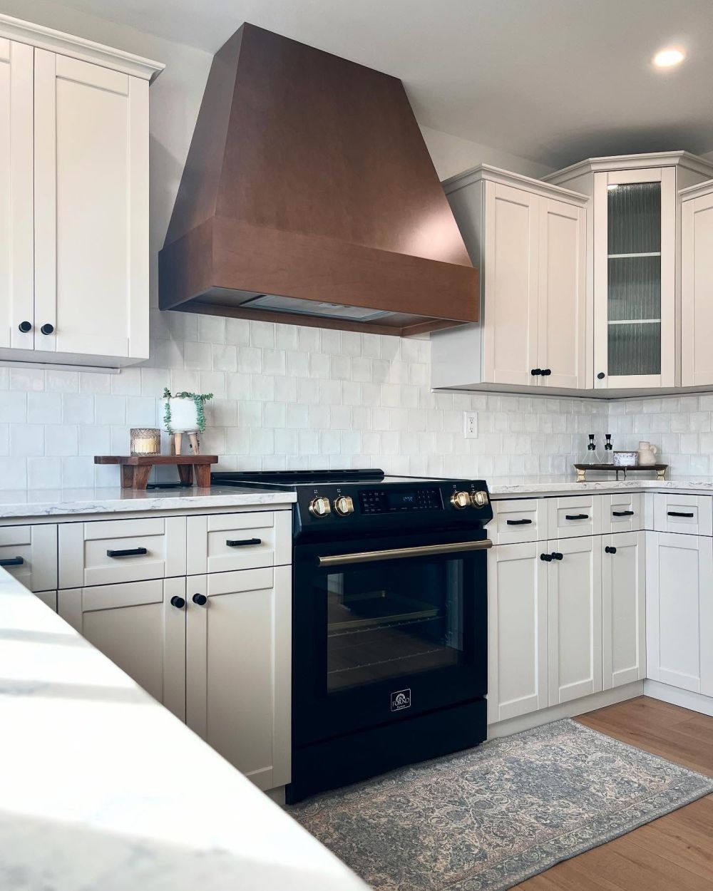 Corner cabinet doors received reeded glass
