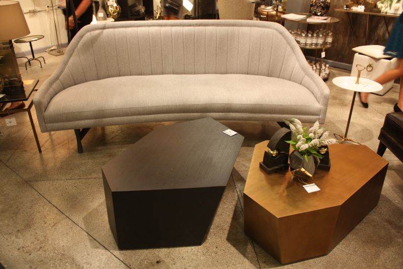 Curved arms give a plain gray sofa its character