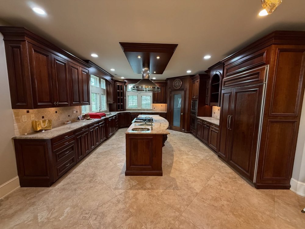 Dark Wood Cabinets Dominated Both Sides of the Kitchen