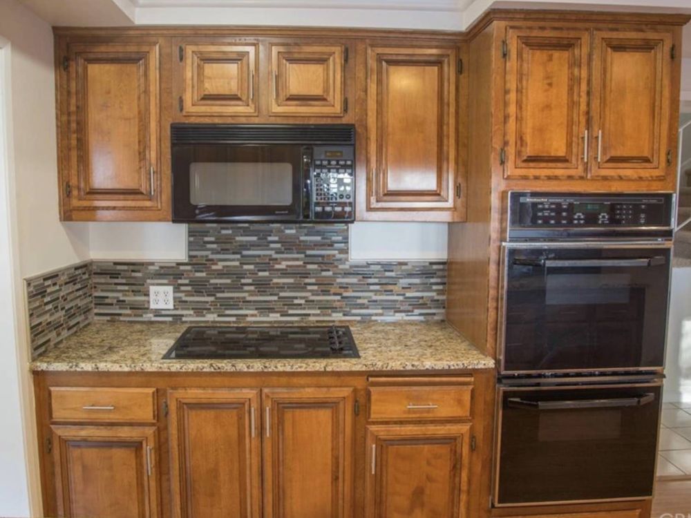 Dark Wood Cabinets Dominated the Original Kitchen