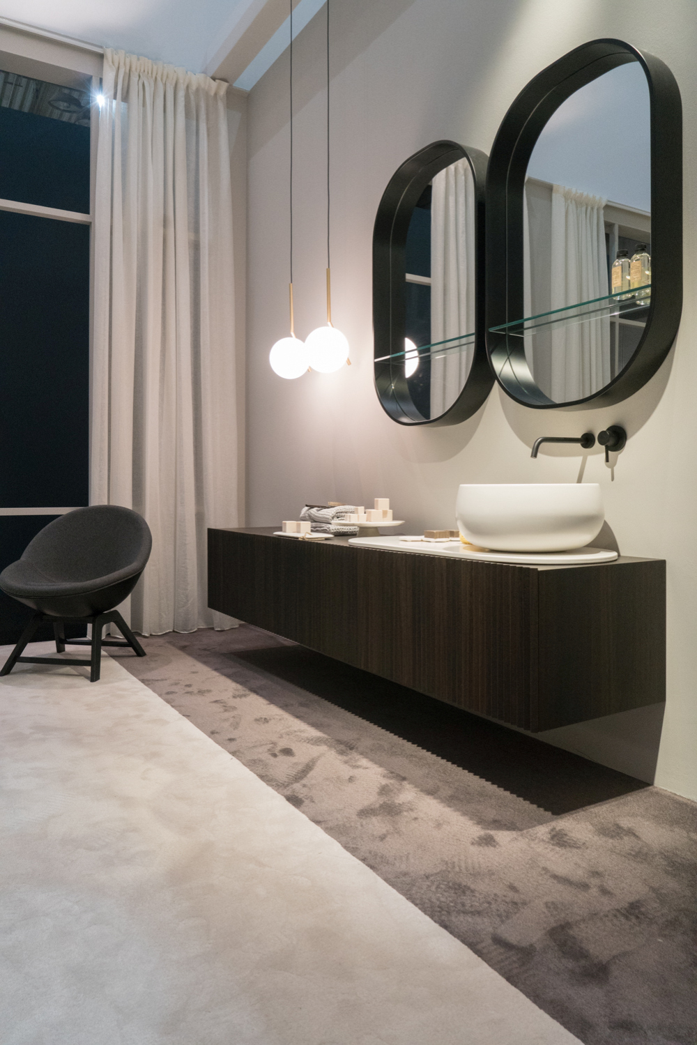 Dark Wood Stops Above the Floor Beneath a Vessel Sink