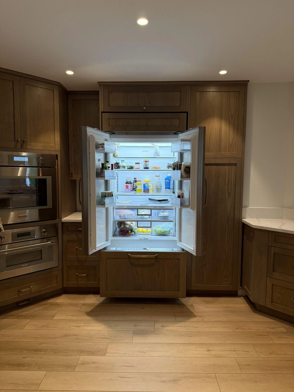 Even the Refrigerator Disappears Behind Custom White Oak Cabinets