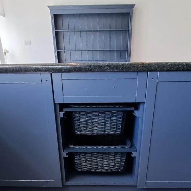 Even the open basket storage blends into the cabinetry