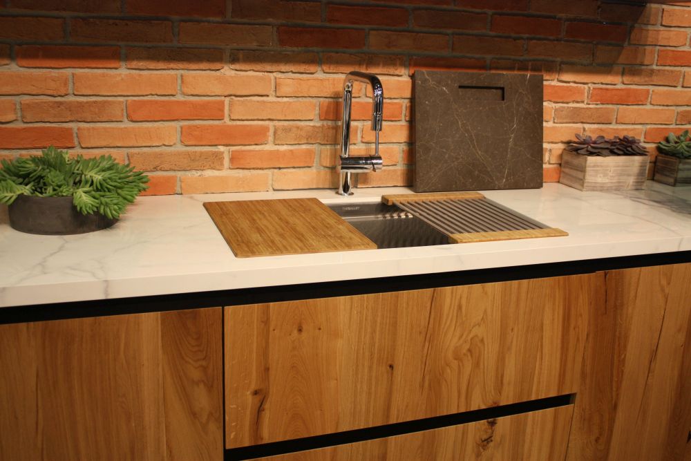 Exposed red brick serves as the backdrop