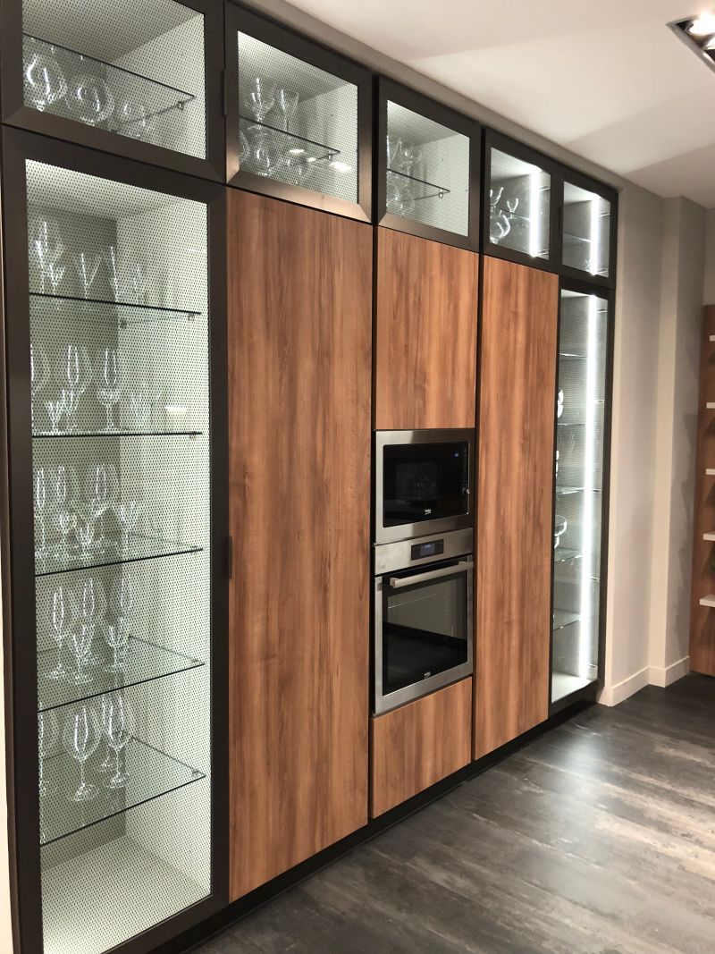 Glass Doors Break Up Walls of Solid Cabinetry