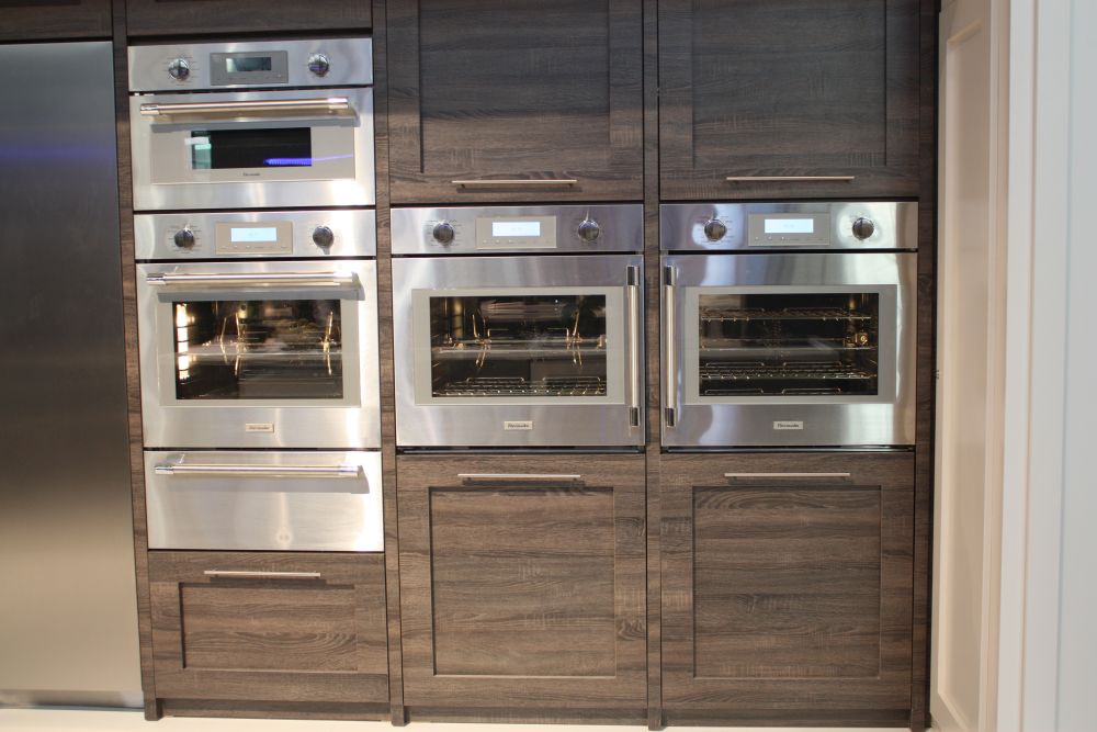 Gray-brown wood-grain cabinetry surrounds a bank