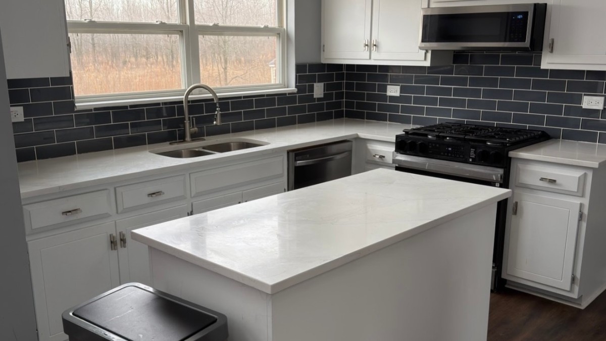 He Painted the White Kitchen Cabinets a Bold Blue and the Whole Kitchen Took on a Custom-Built Look