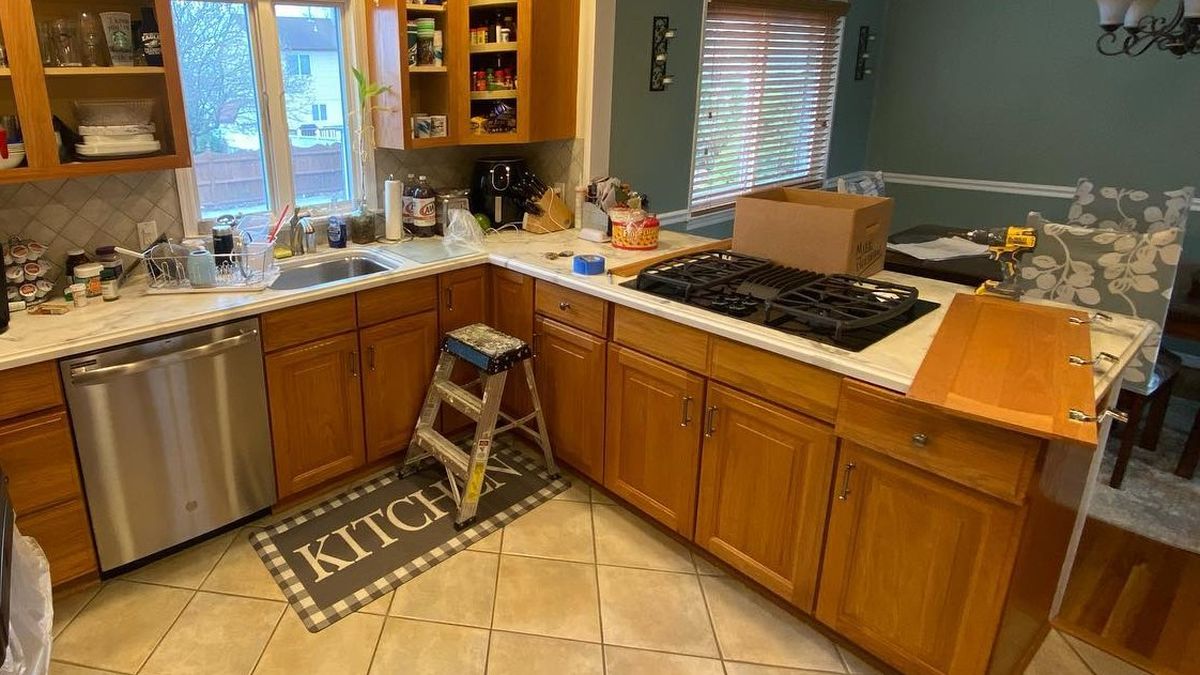 He Spray-Painted the Orange Oak Cabinets Sea Salt and Made the Old Beige Tile Floors Work