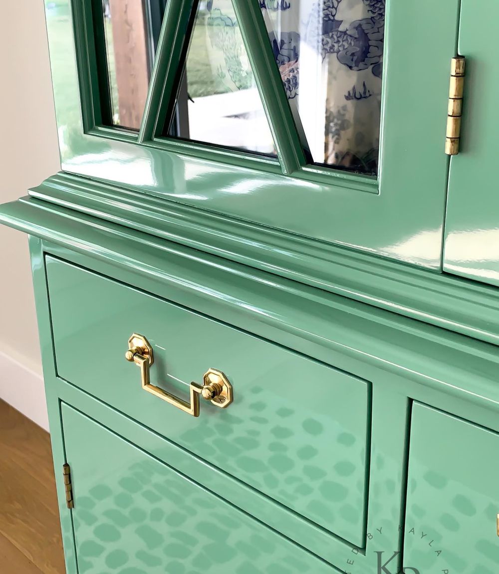 Hinges and moldings remain visible beneath the new finish