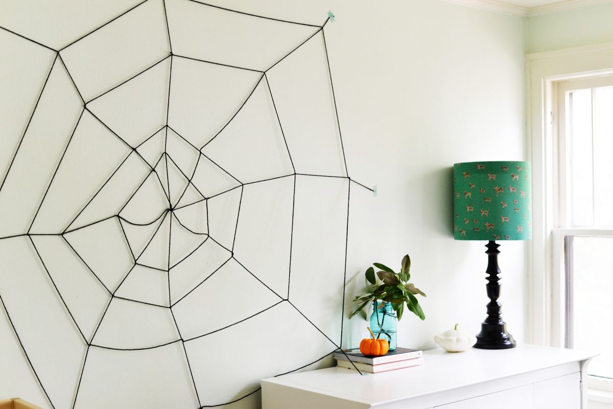 Large spider web on wall